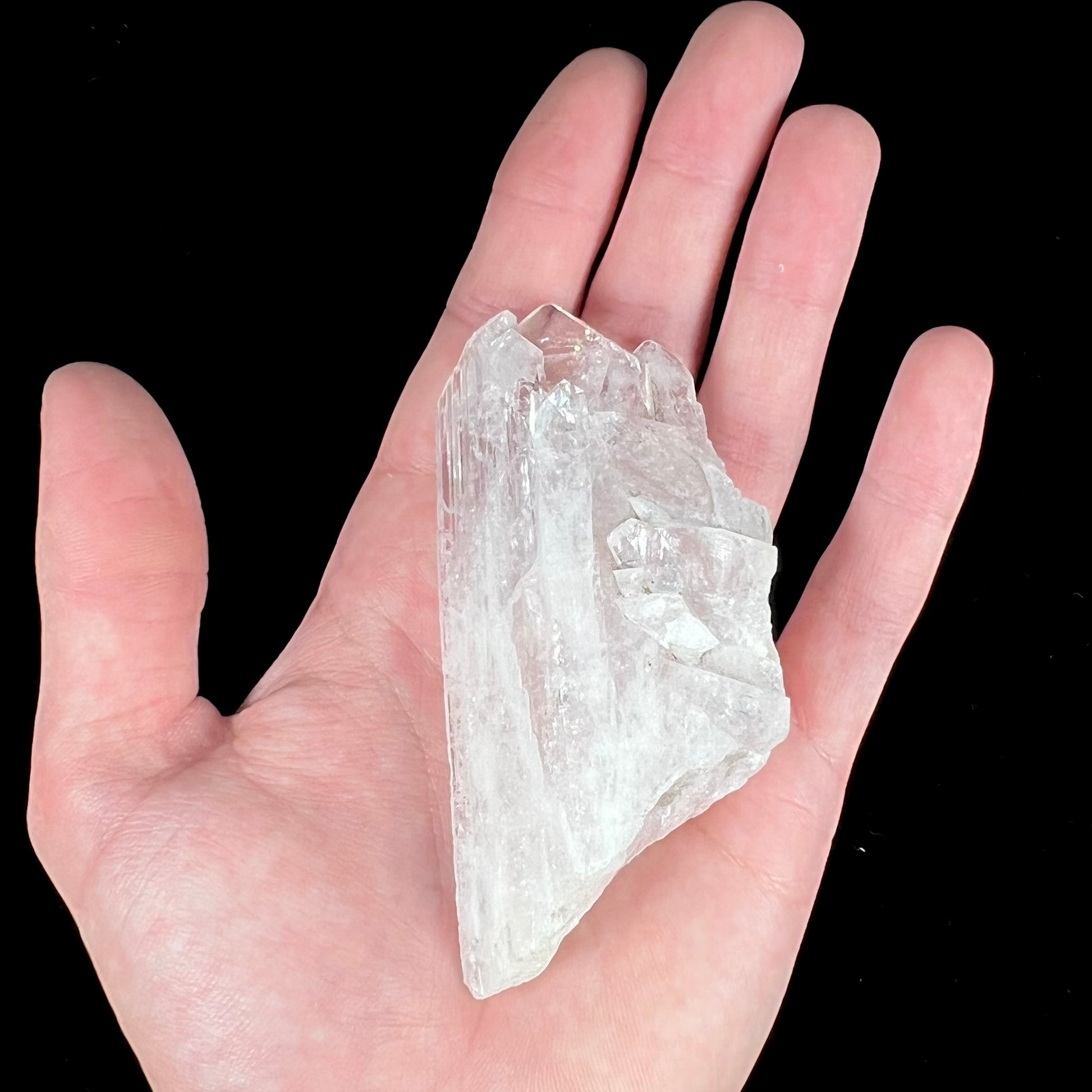 A 3.6 inch long pink danburite crystal specimen.  There are five twinned crystals coming off of a larger crystal.