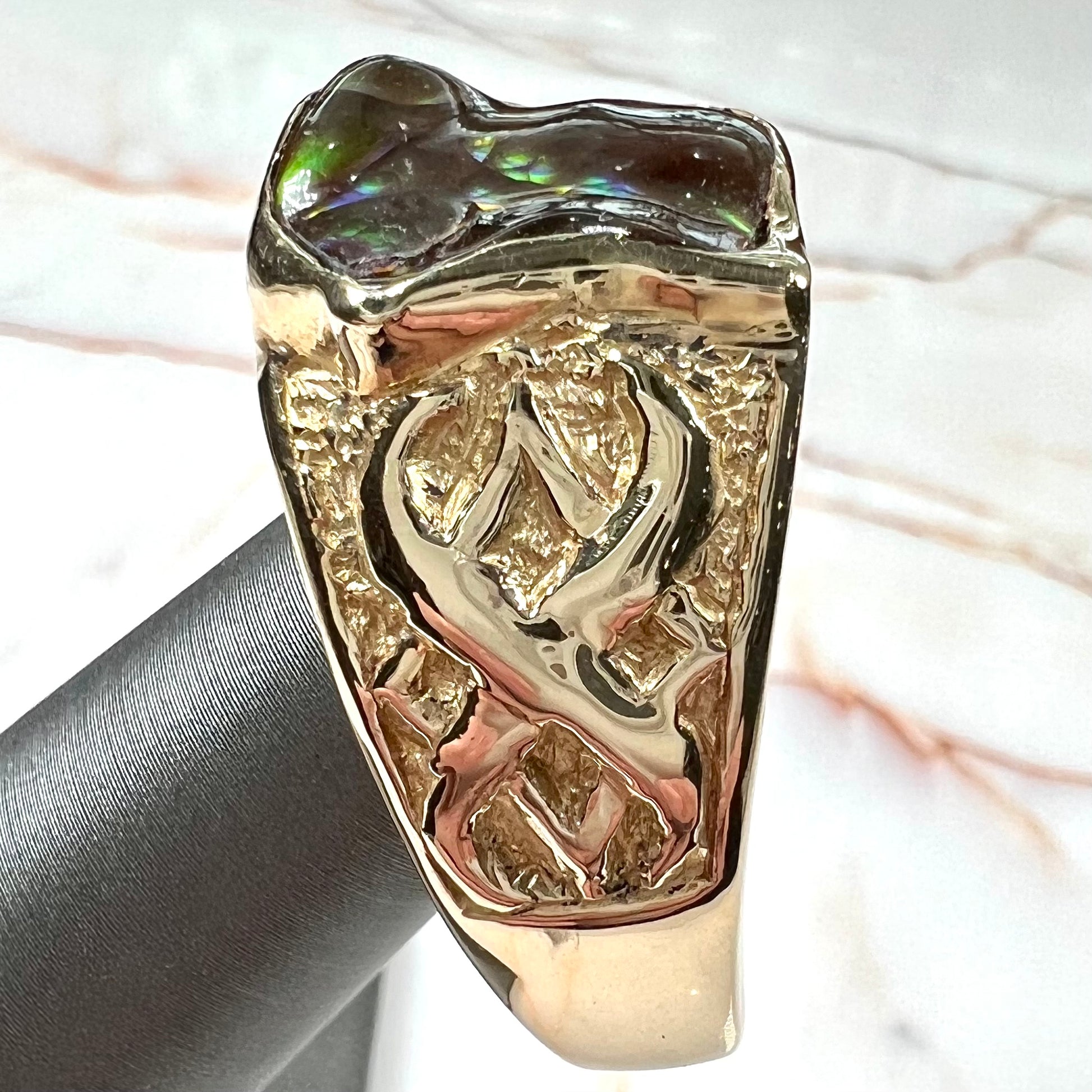 Custom, heavy yellow gold men's ring set with fire agate from Deer Creek, Arizona.