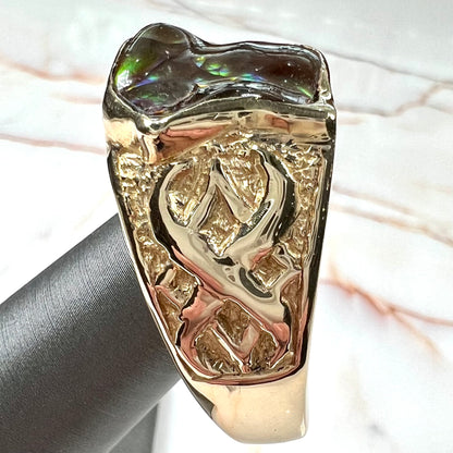 Custom, heavy yellow gold men's ring set with fire agate from Deer Creek, Arizona.