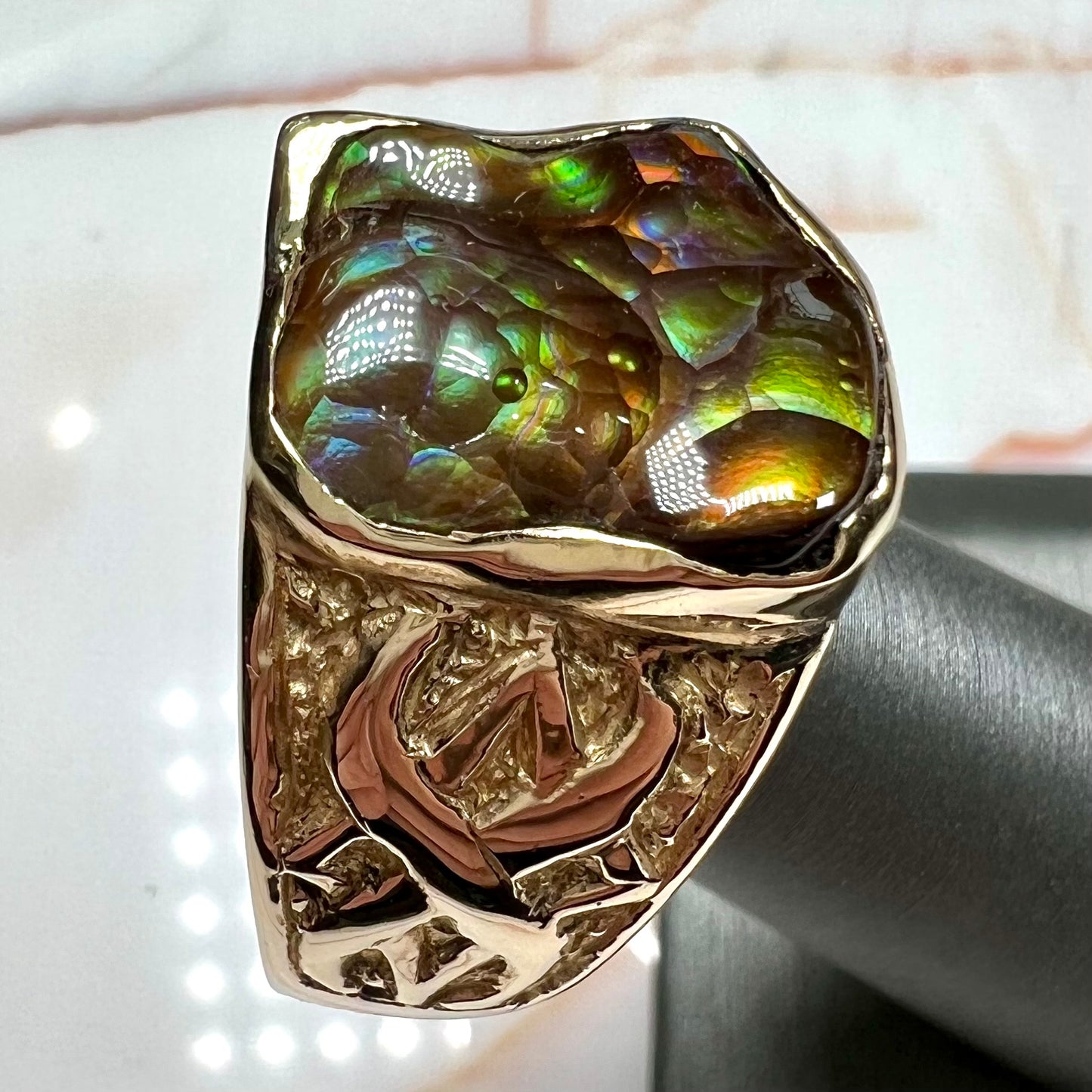 Custom, heavy yellow gold men's ring set with fire agate from Deer Creek, Arizona.