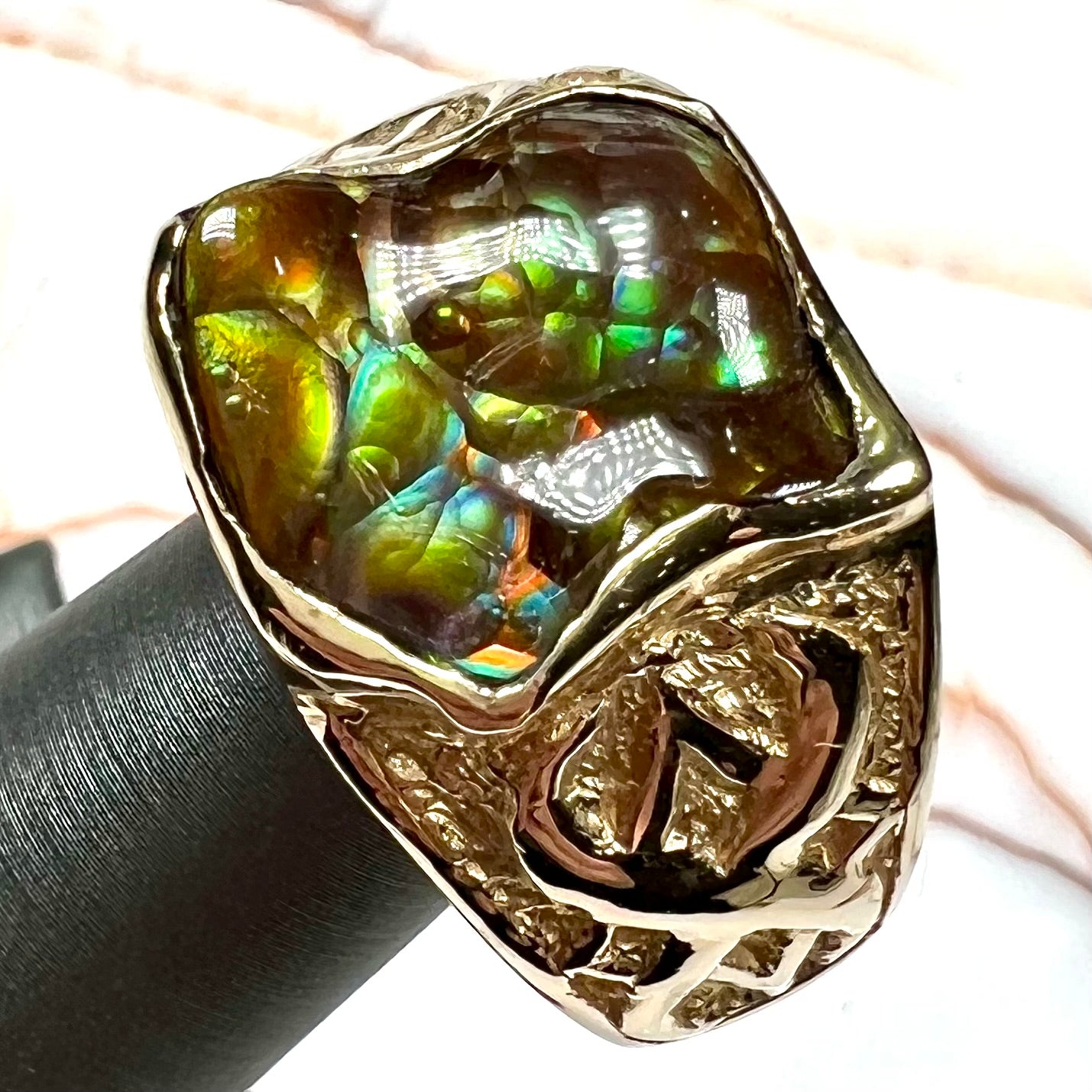Custom, heavy yellow gold men's ring set with fire agate from Deer Creek, Arizona.