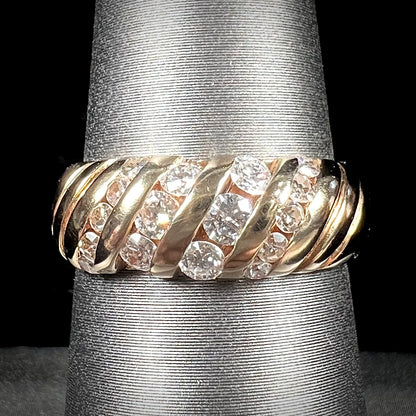 A ladies' channel set gold diamond ring.