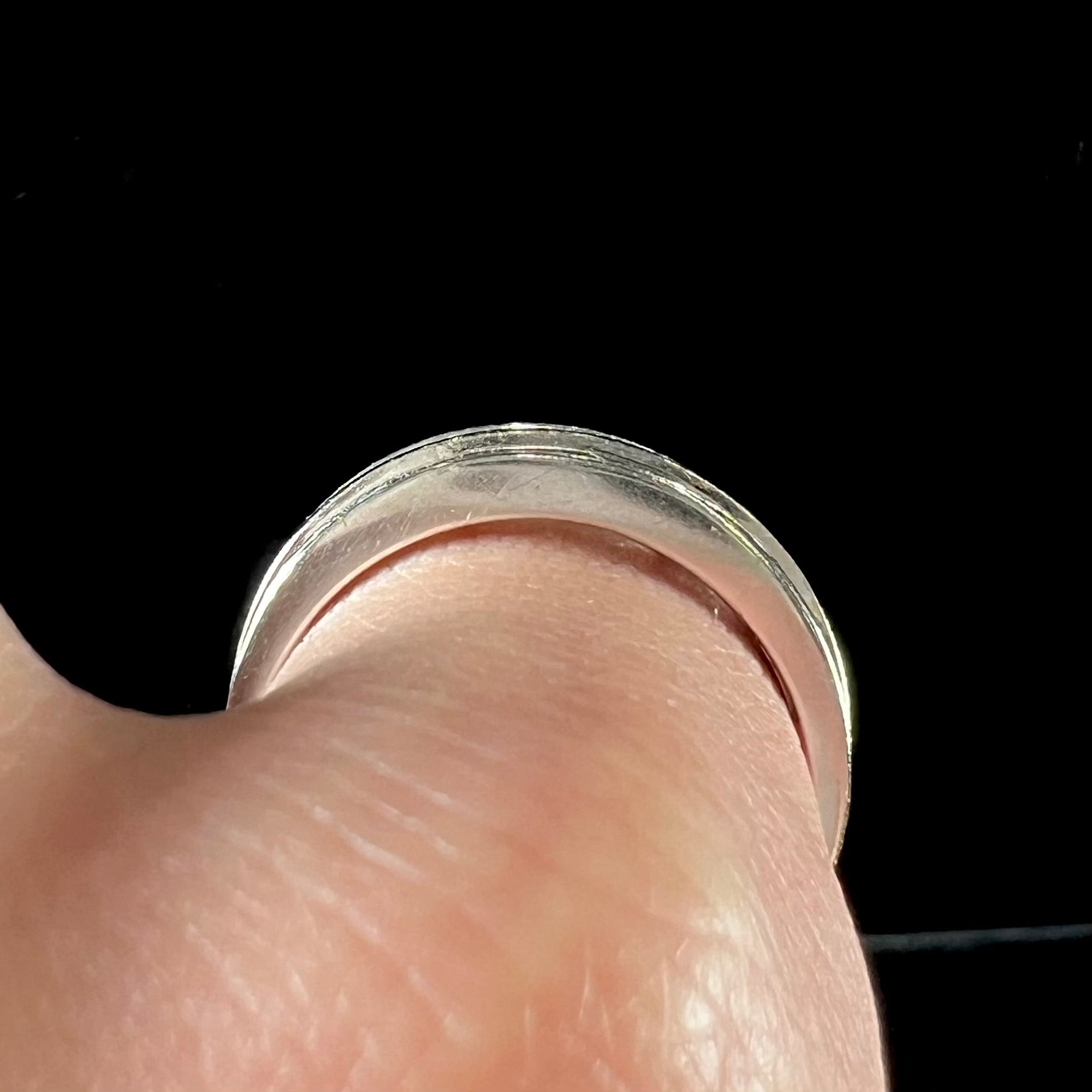 A men's estate white gold five stone diamond ring.