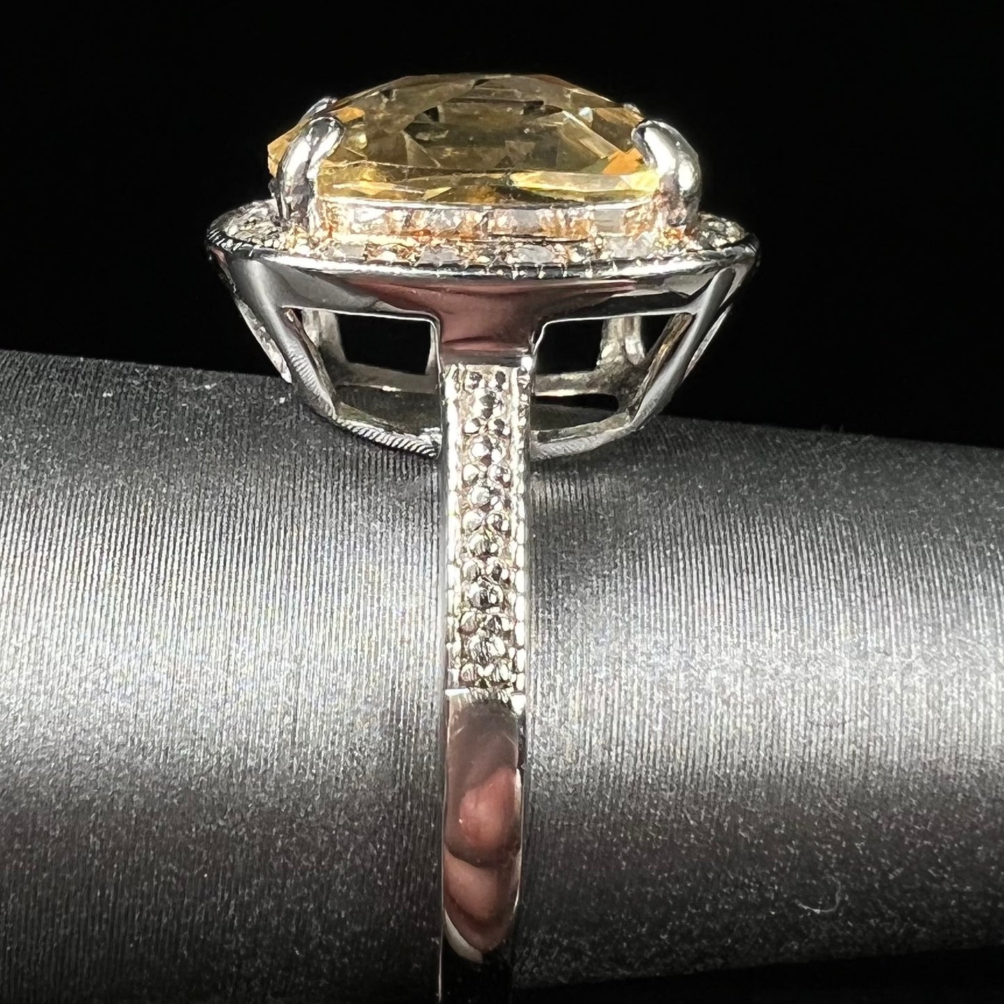 A silver cushion cut citrine and diamond halo ladies' ring.