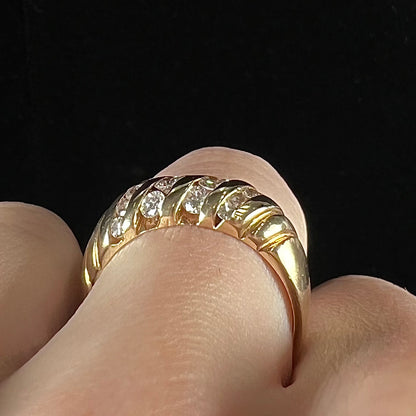 A ladies' channel set gold diamond ring.