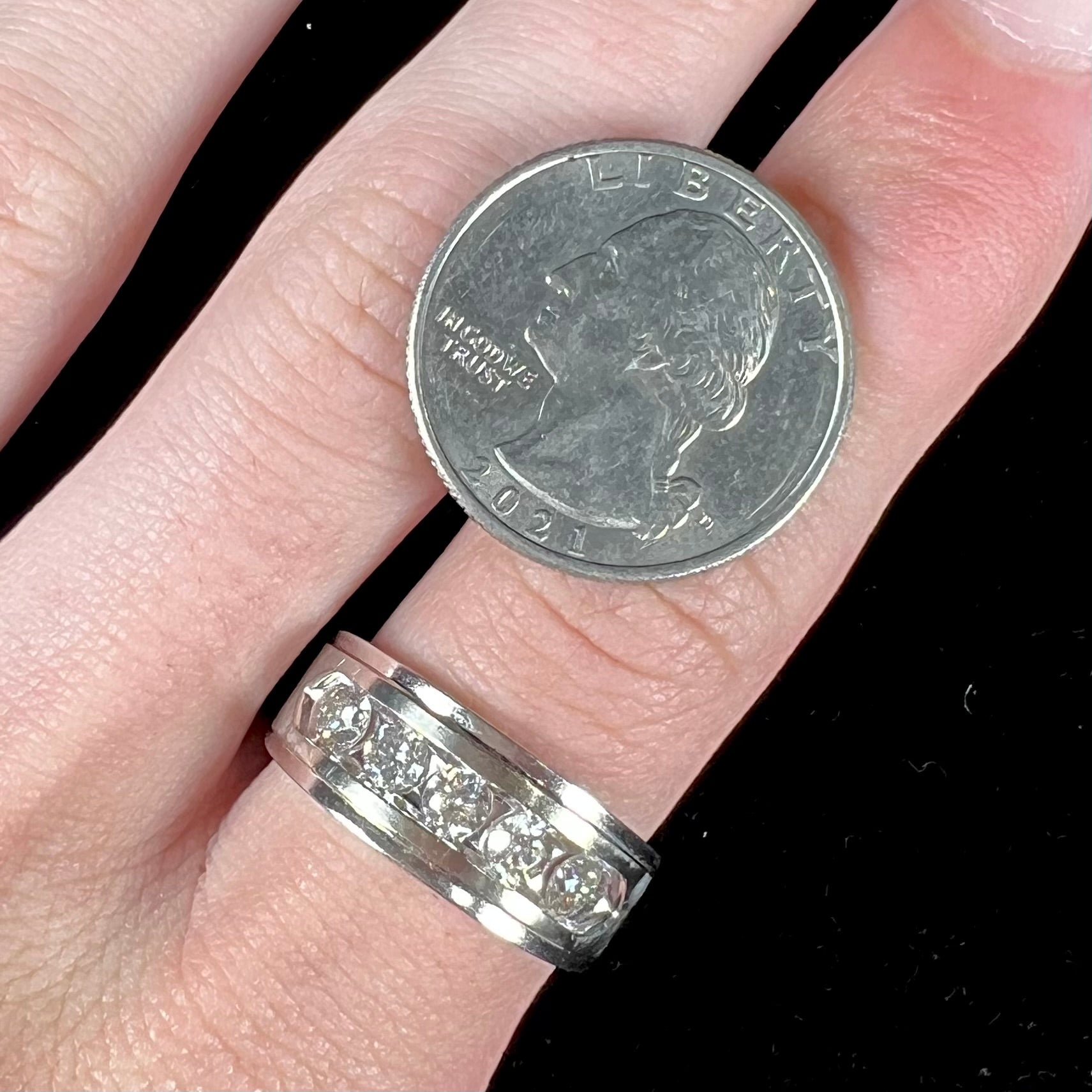 A men's estate white gold five stone diamond ring.