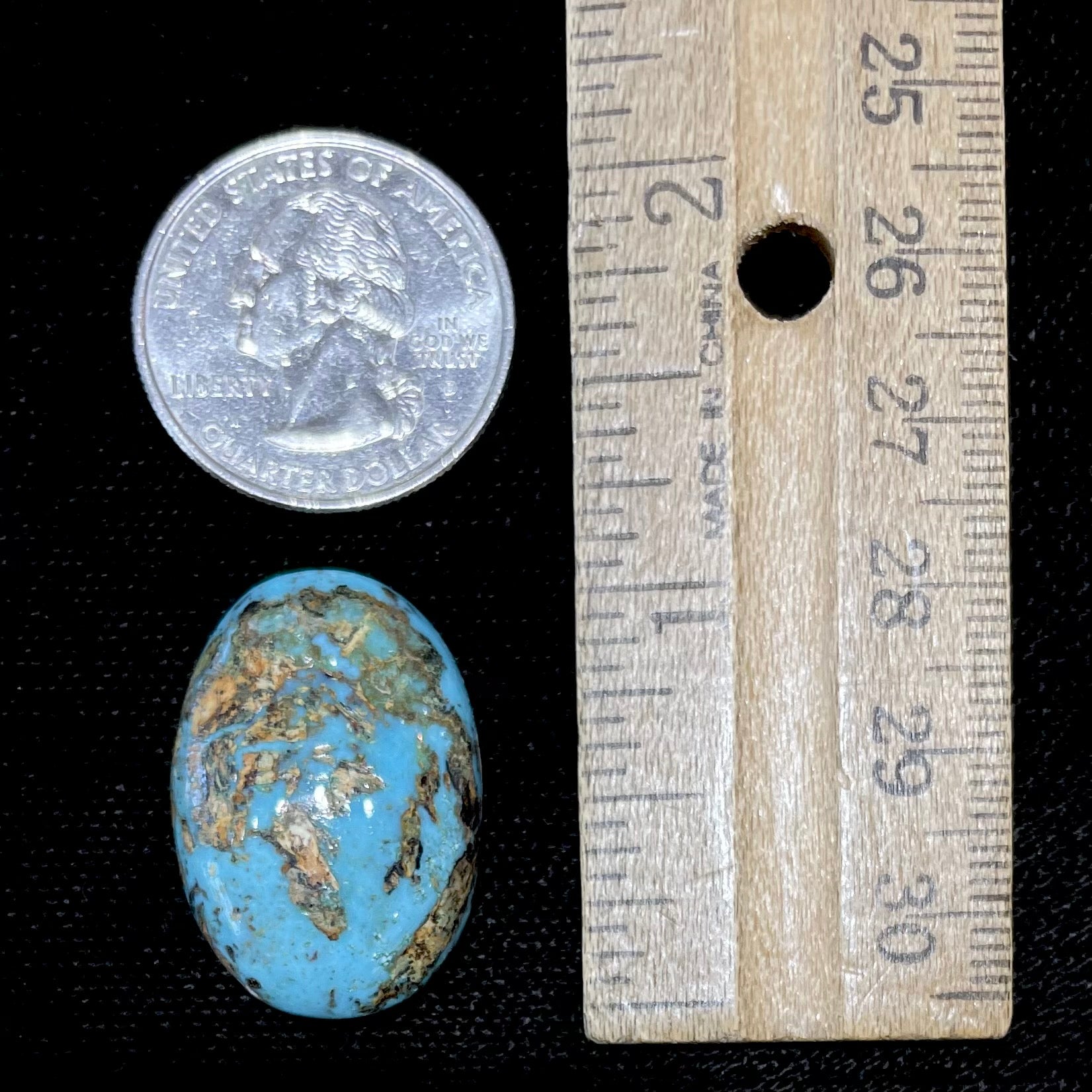 A loose, oval cabochon cut turquoise stone from Sonora, Mexicao.