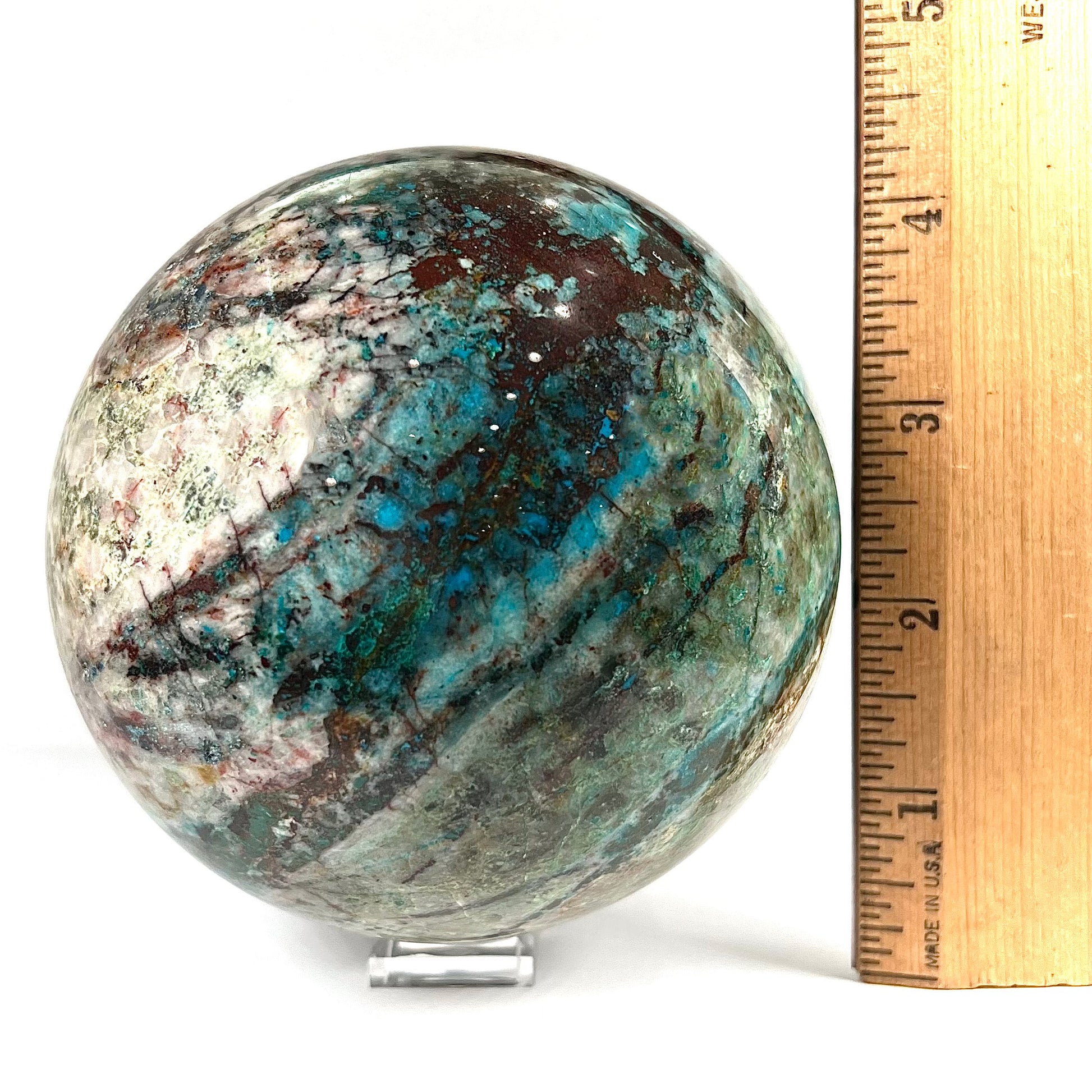 A stone sphere cut from Eilat Stone, mined in Israel.  Material contains turquoise, chrysocolla, azurite, malachite, and cuprite.