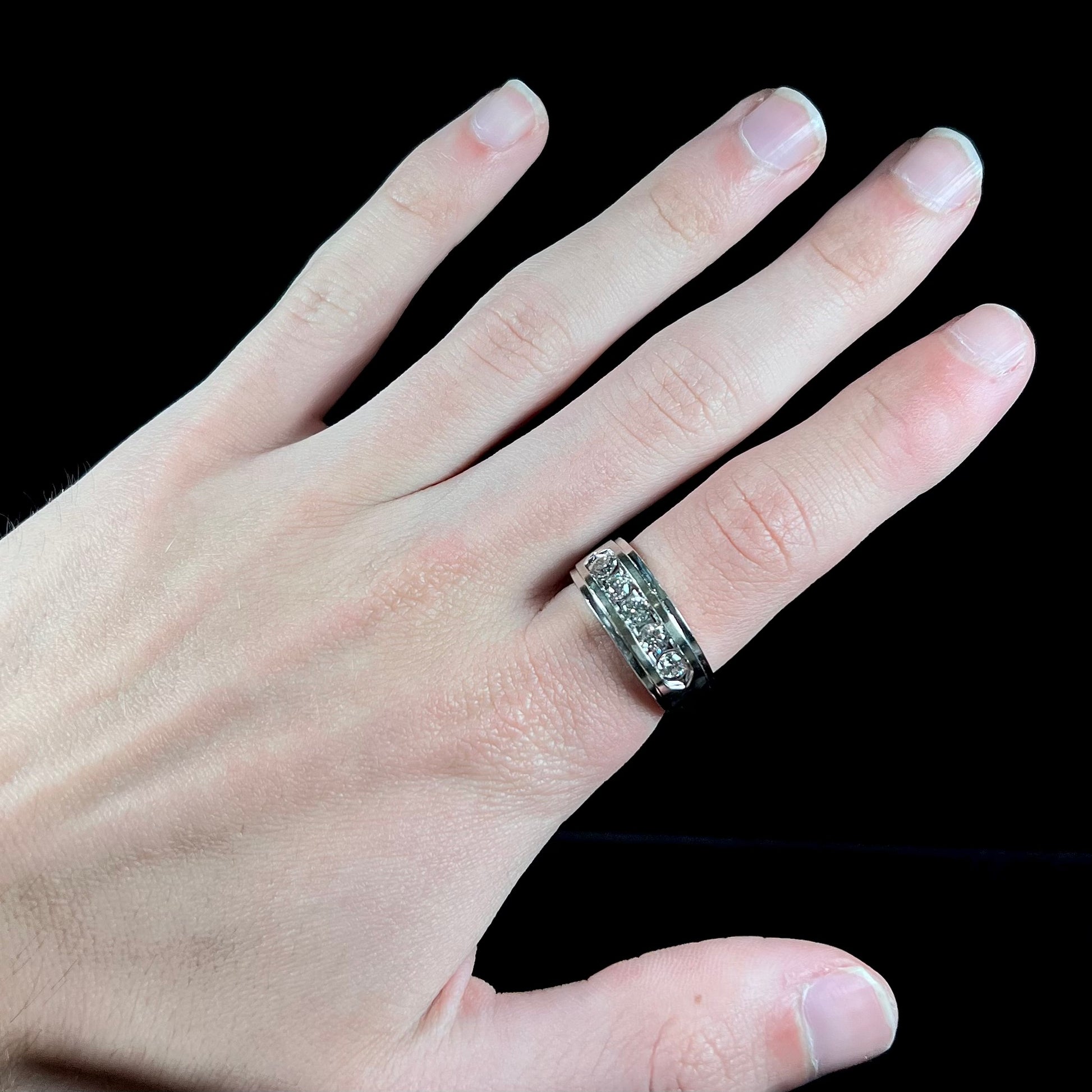 A men's estate white gold five stone diamond ring.