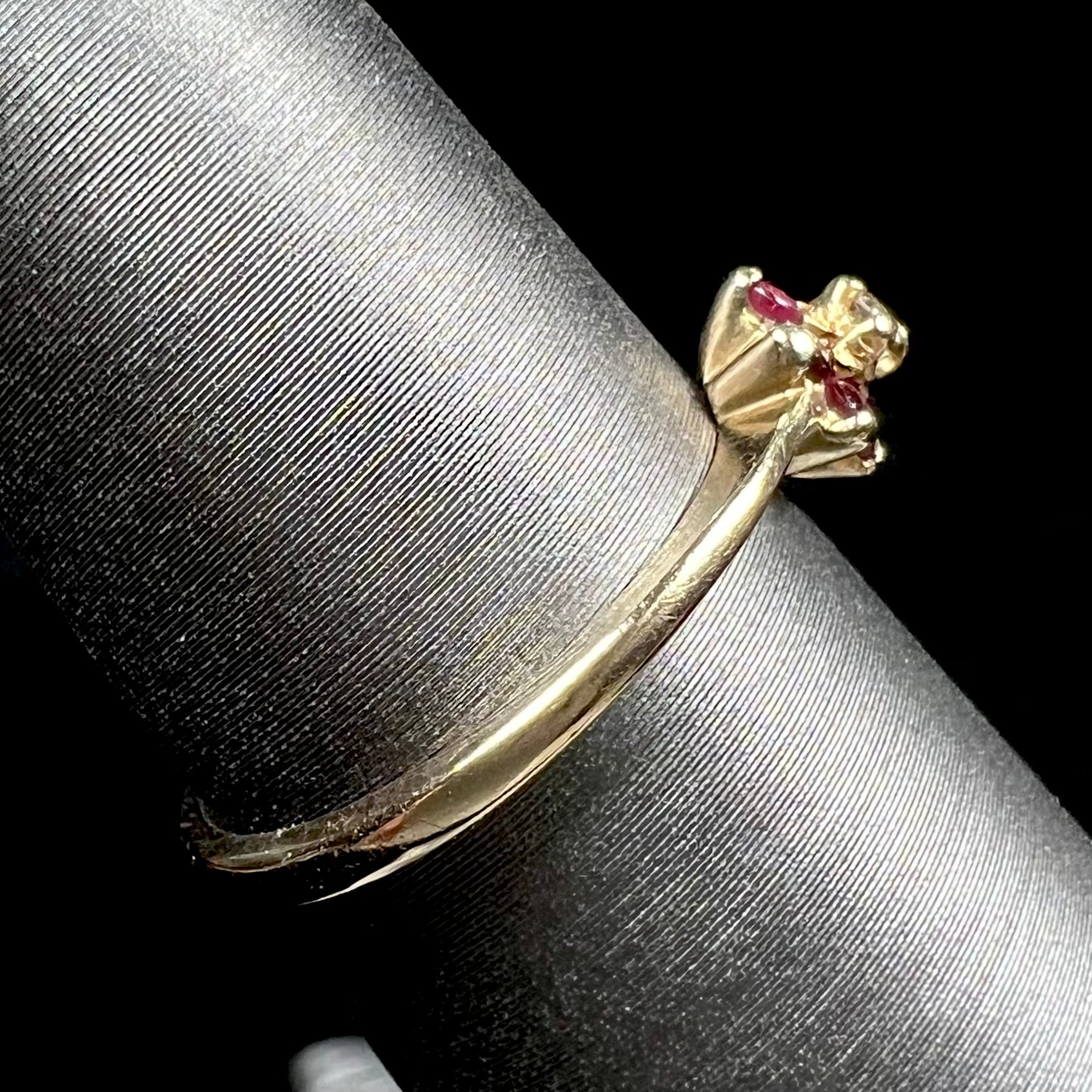 A ladies' estate yellow gold ruby and diamond cluster ring.