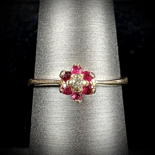 A ladies' estate yellow gold ruby and diamond cluster ring.