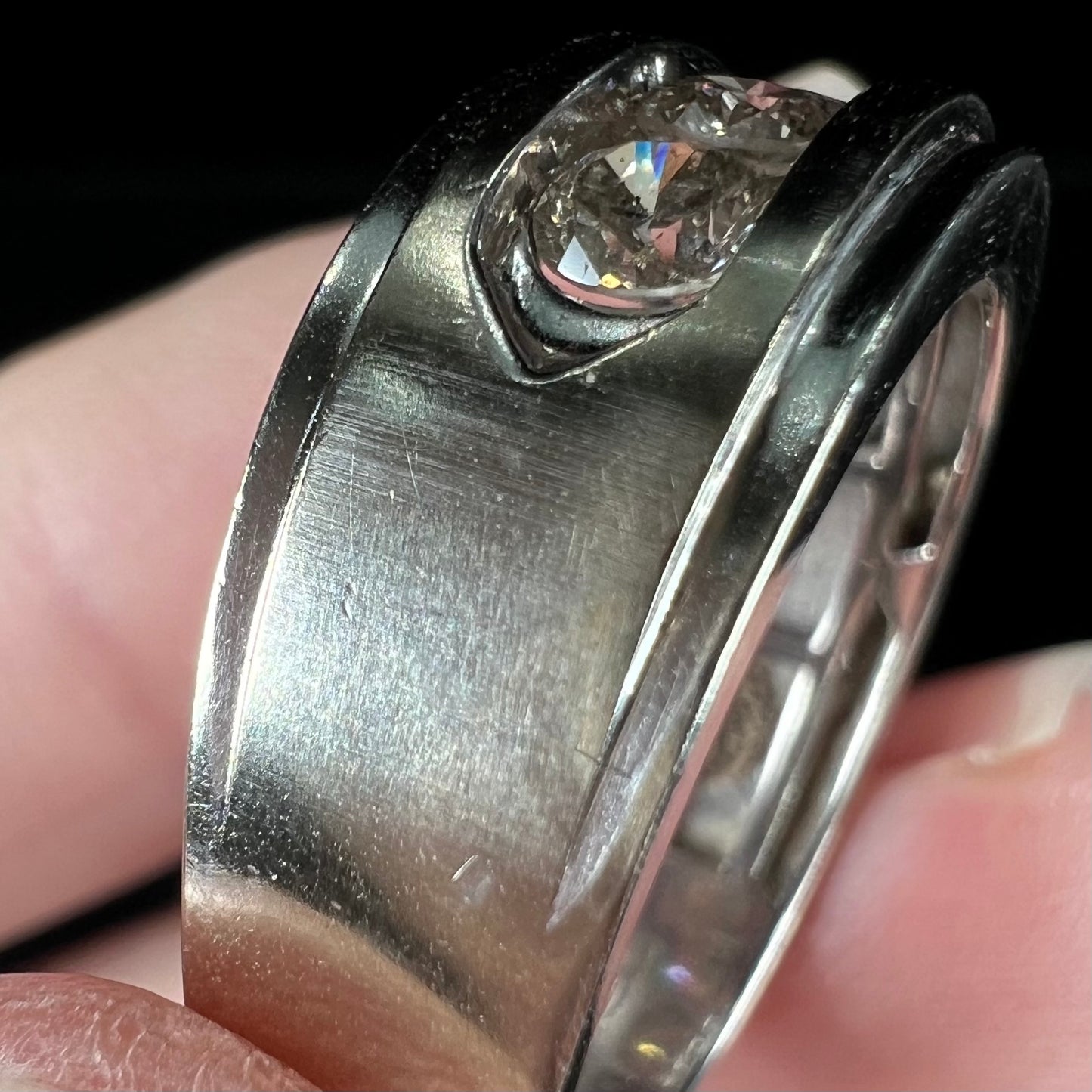 A men's estate white gold five stone diamond ring.