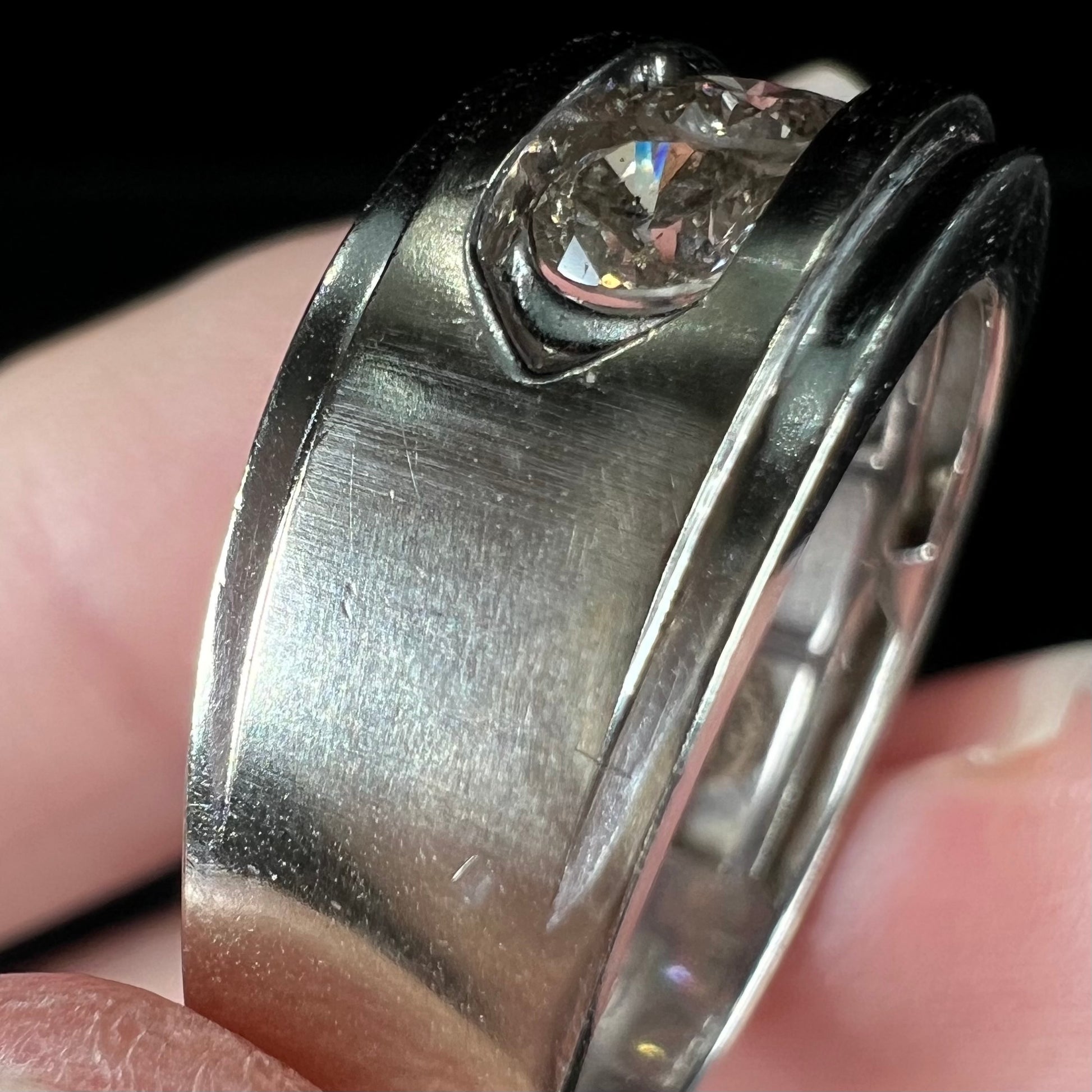 A men's estate white gold five stone diamond ring.
