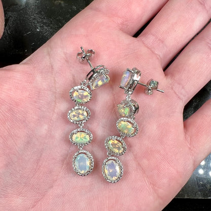 A pair of sterling silver Ethiopian opal dangle earrings.