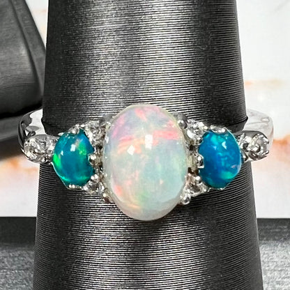 A sterling silver ring, earring, and necklace set made of Ethiopian opals and cubic zirconia.