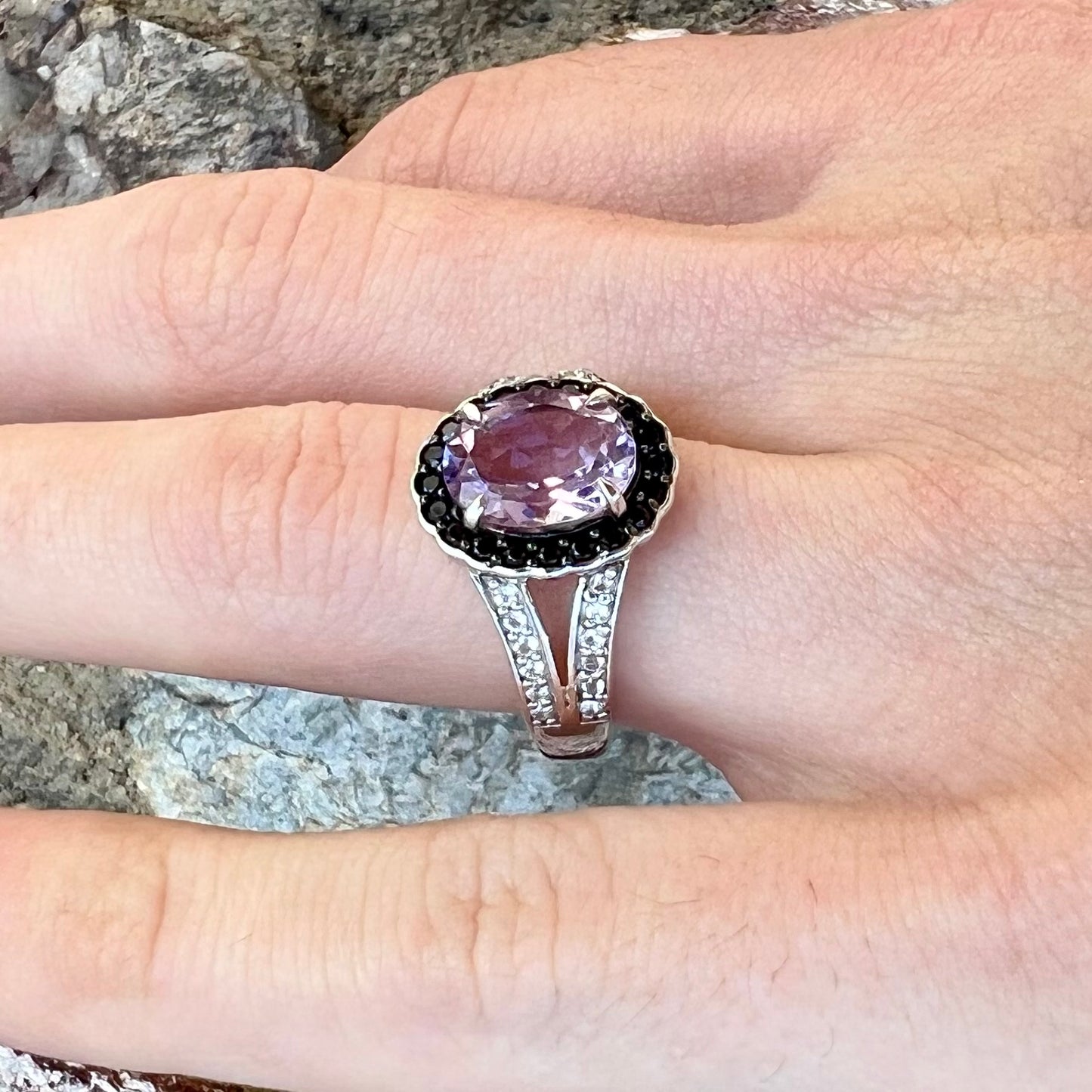 Sterling silver ladies' ring made with Rose de France amethyst set in a black spinel halo with white topaz accents.