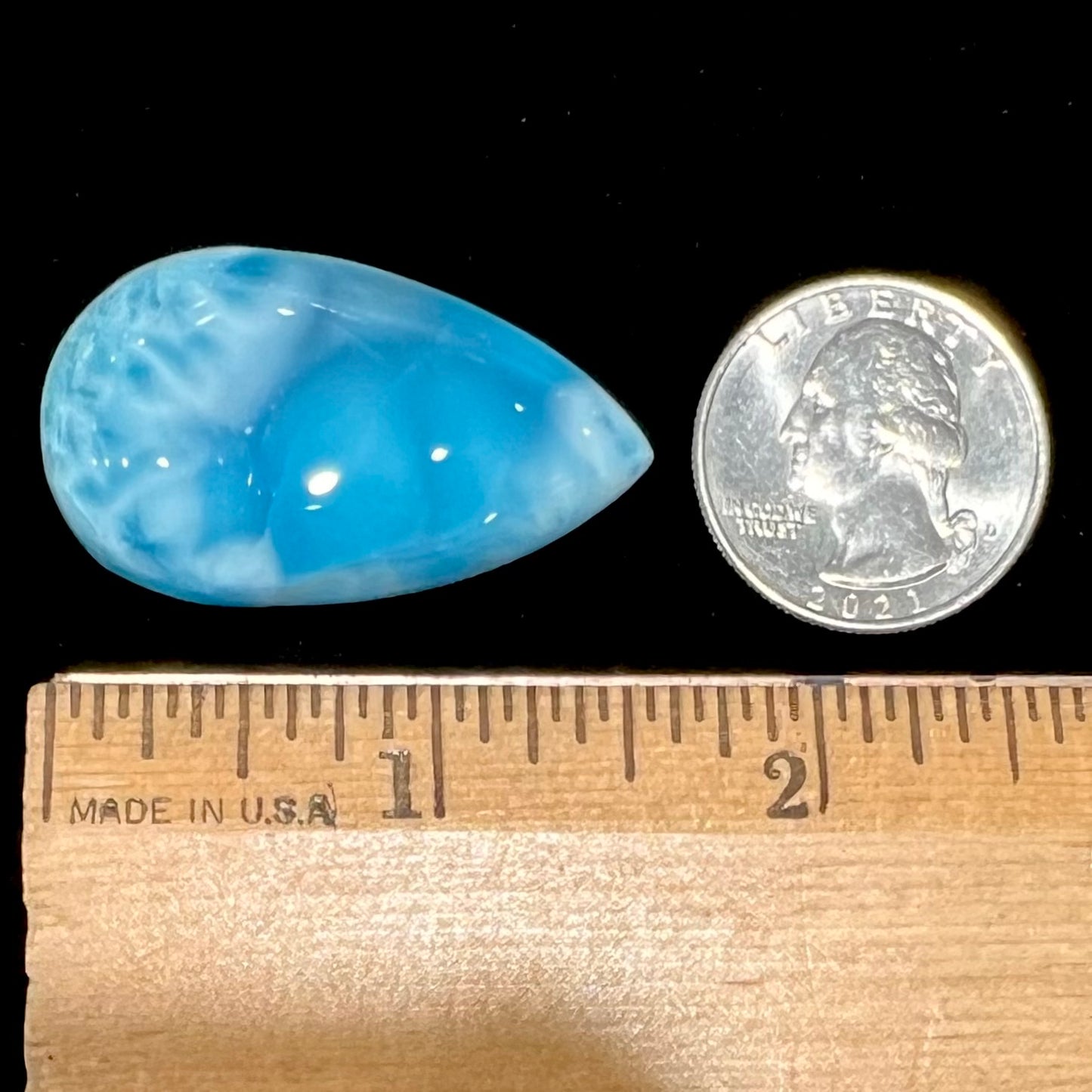 A loose, pear shaped larimar cabochon.  The material is AAA+ grade.
