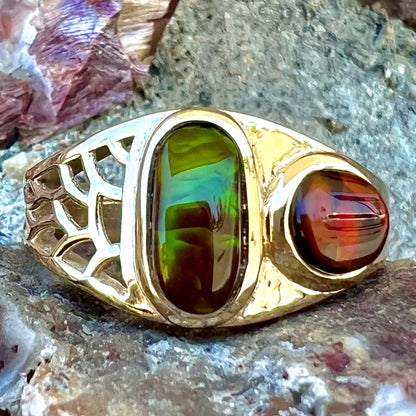 A ladies' yellow gold ring set with two fire agate stones: one green, and one red.