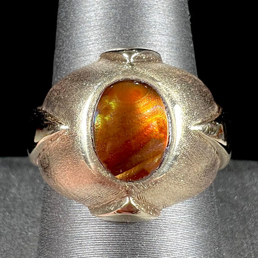 A men's brushed yellow gold fire agate ring with polished accents.