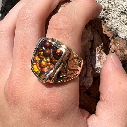 A men's custom fire agate solitaire ring cast in yellow gold.