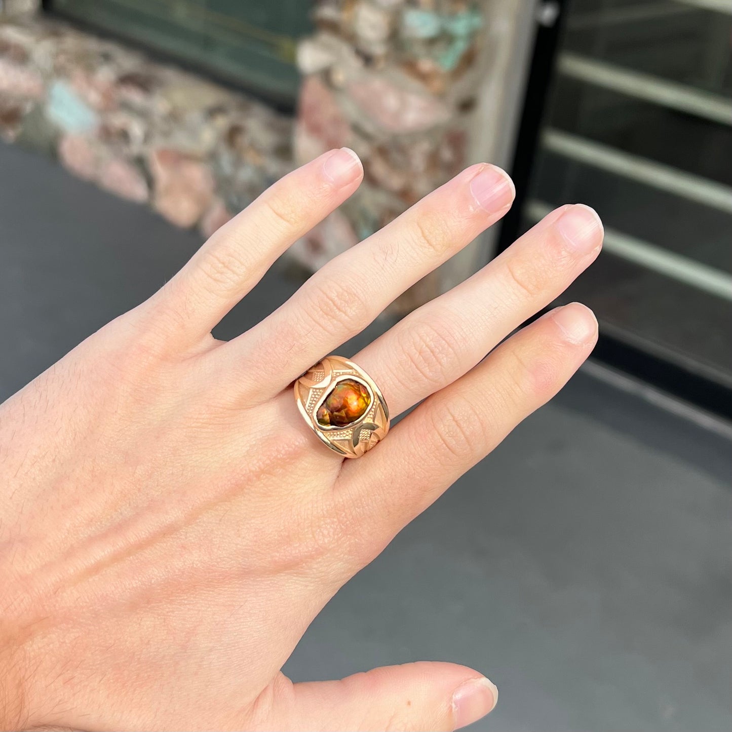 A men's 14kt yellow gold Mexican fire agate ring.