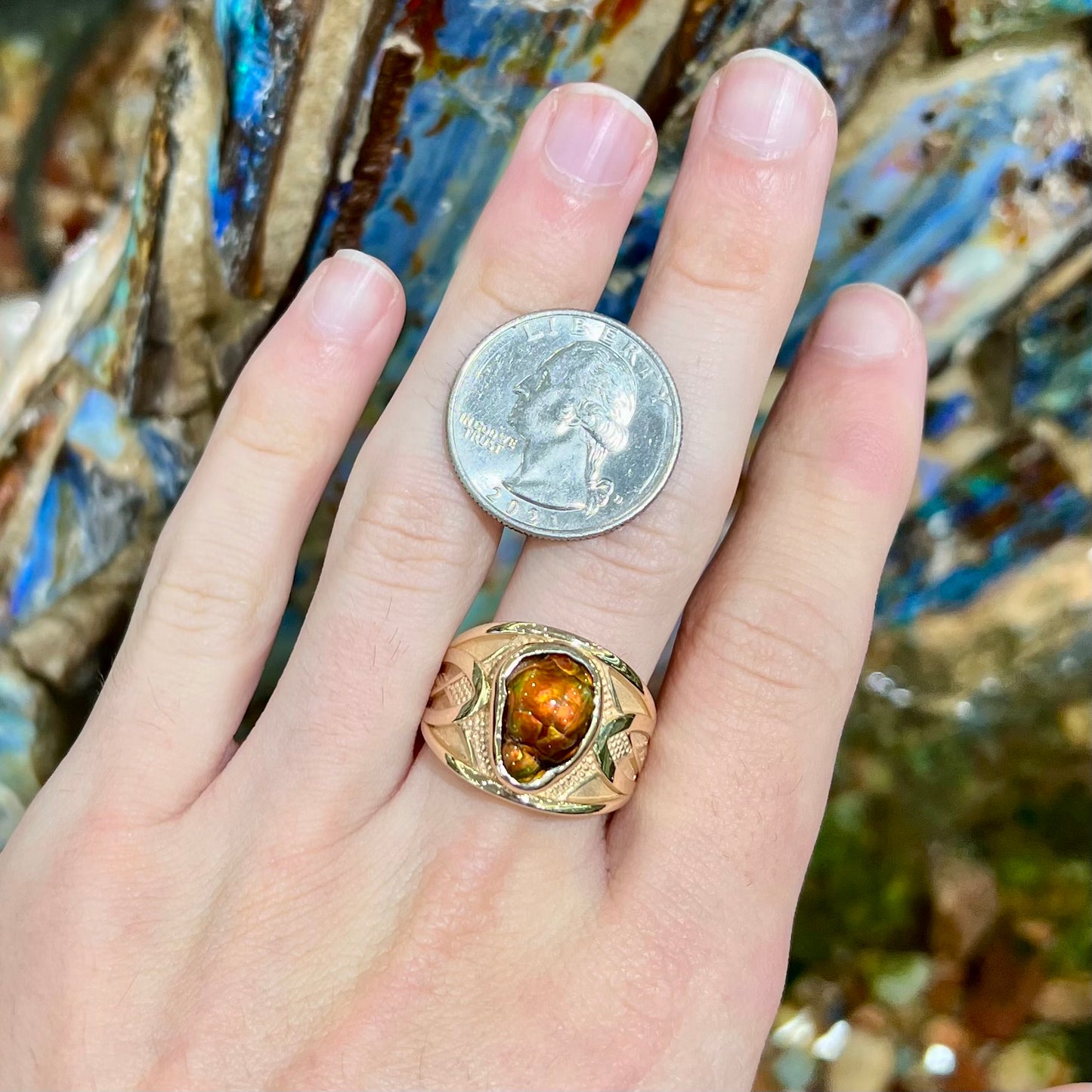 A men's 14kt yellow gold Mexican fire agate ring.