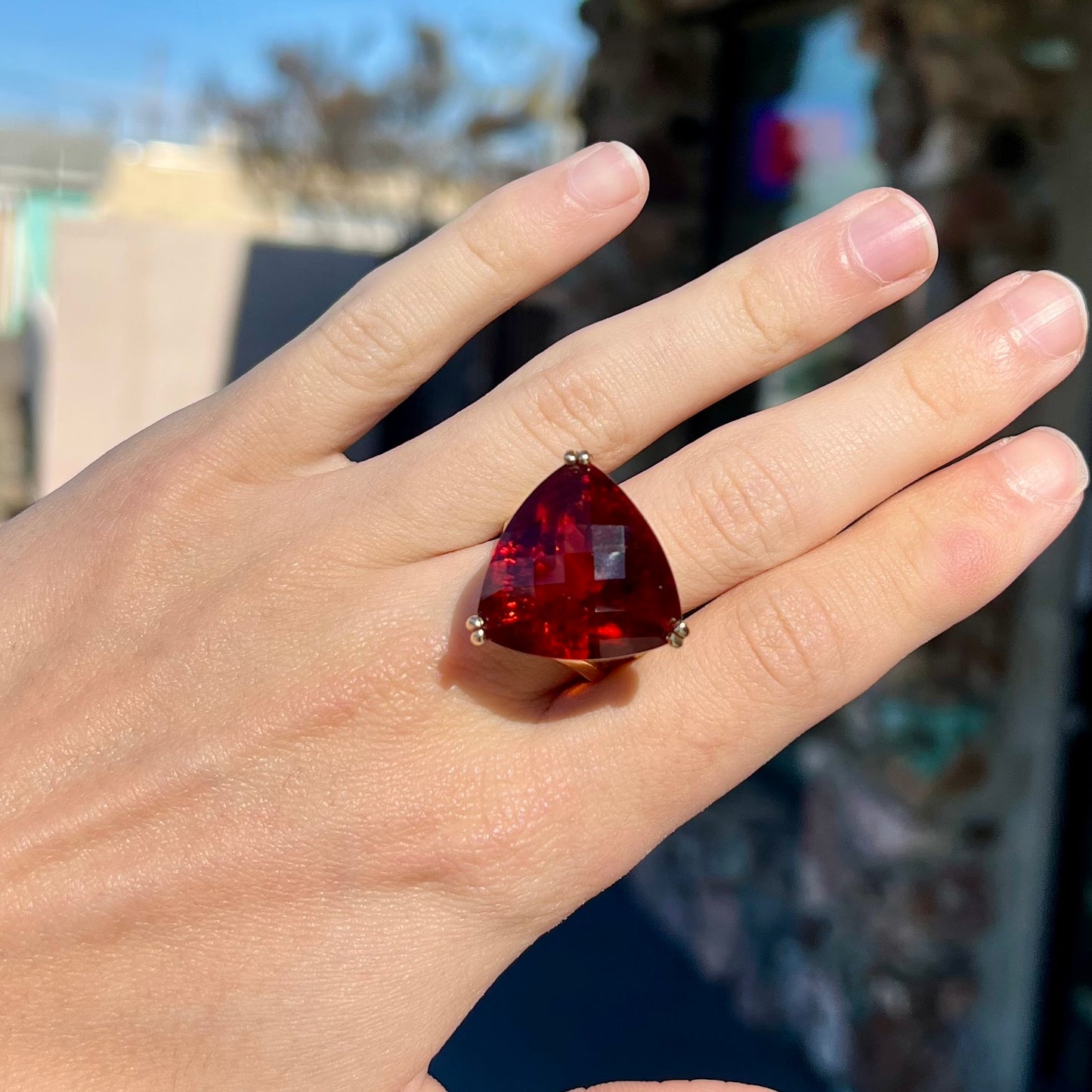 A ladies' trillion cut madeira citrine cocktail ring handmade in yellow gold.