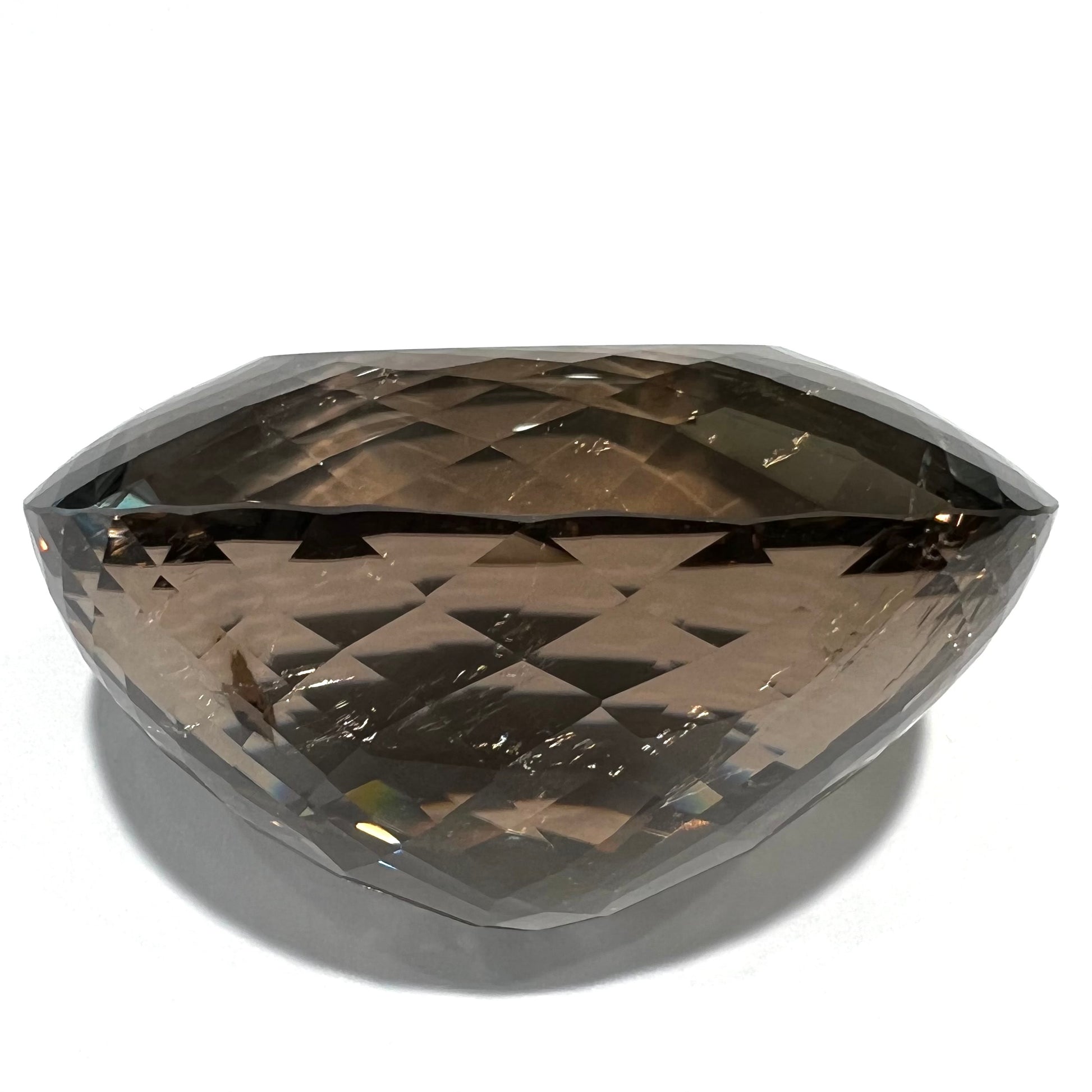 A loose, 1400+ carat smoky quartz gemstone.  The stone has a fracture that runs throughout the stone to the table.