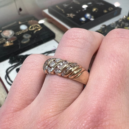 A ladies' channel set gold diamond ring.
