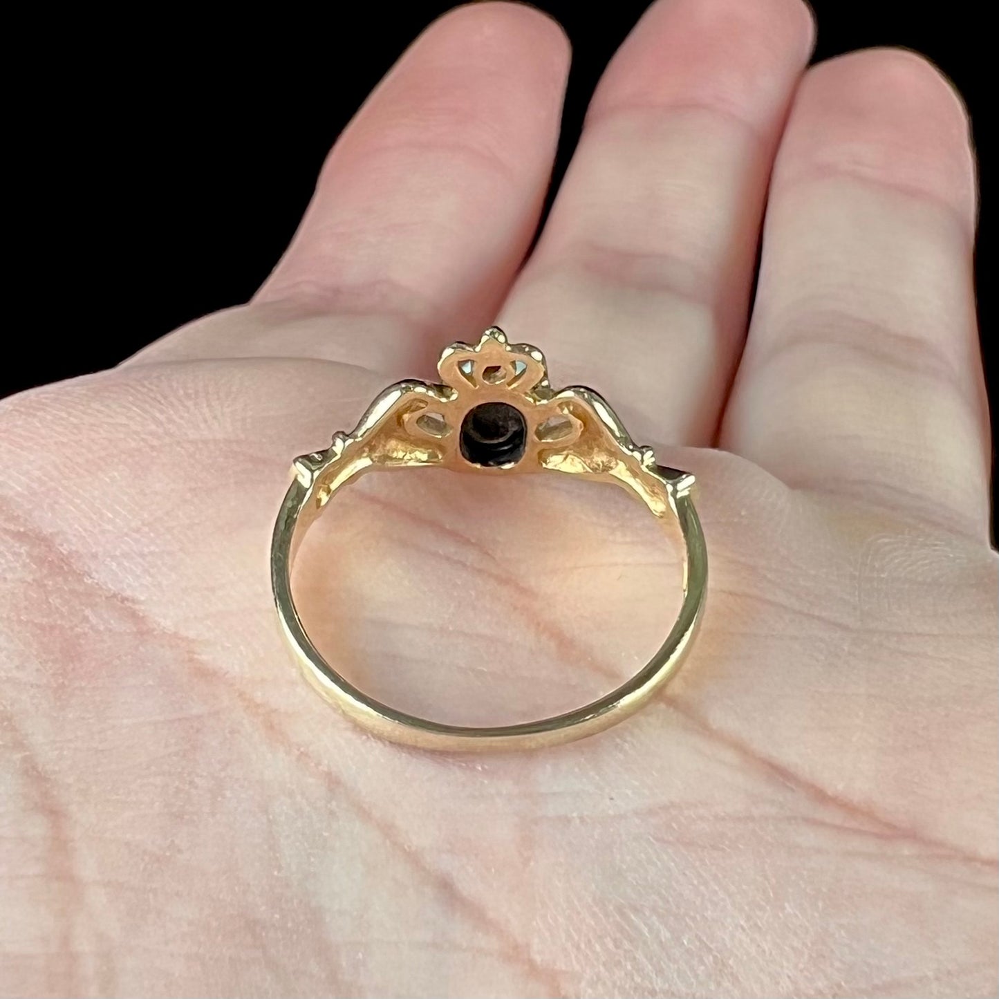 A vintage ladies' yellow gold opal and diamond claddagh ring.