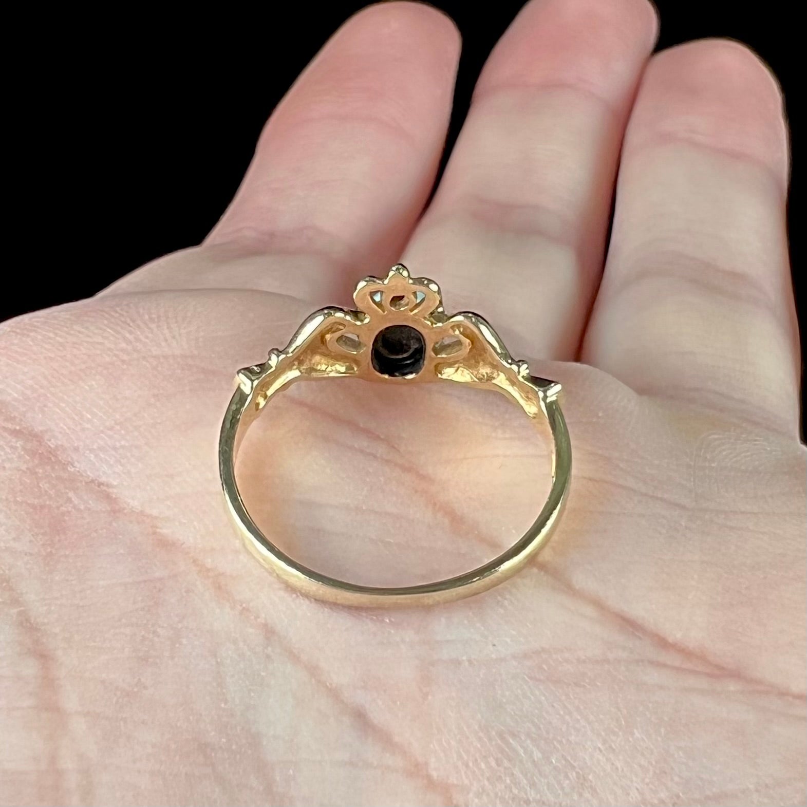 A vintage ladies' yellow gold opal and diamond claddagh ring.