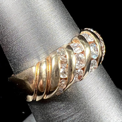 A ladies' channel set gold diamond ring.