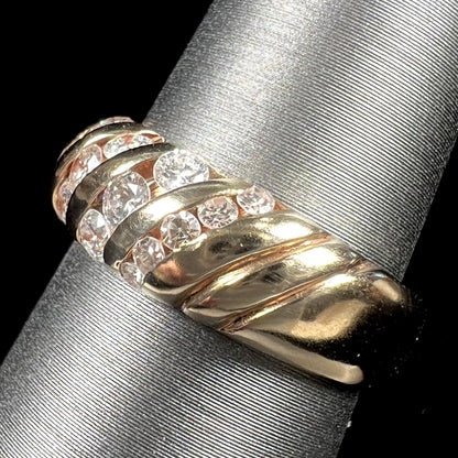 A ladies' channel set gold diamond ring.