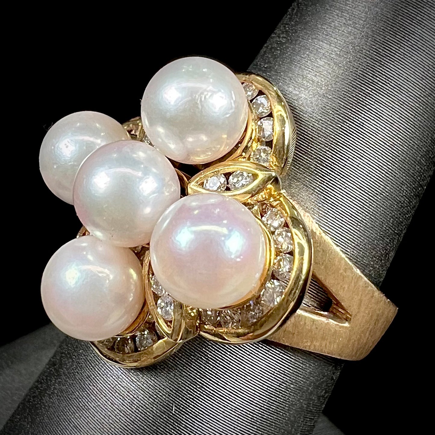 A ladies' vintage 1960's pink Akoya pearl and diamond quatrefoil ring.  The shank of the ring is textured.