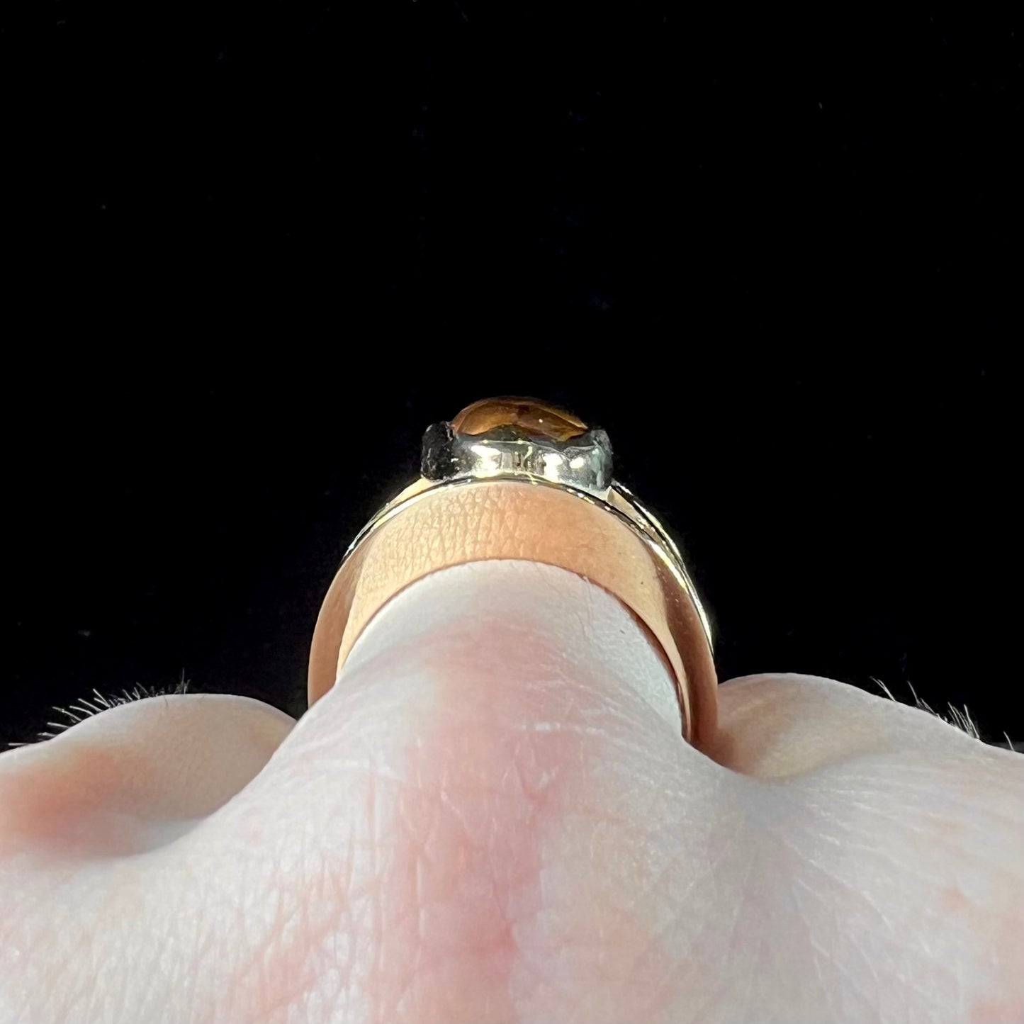 A men's 14kt yellow gold Mexican fire agate ring.