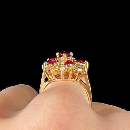 A ladies' vintage yellow gold cluster ring set with diamonds and pigeon blood red Burma rubies.