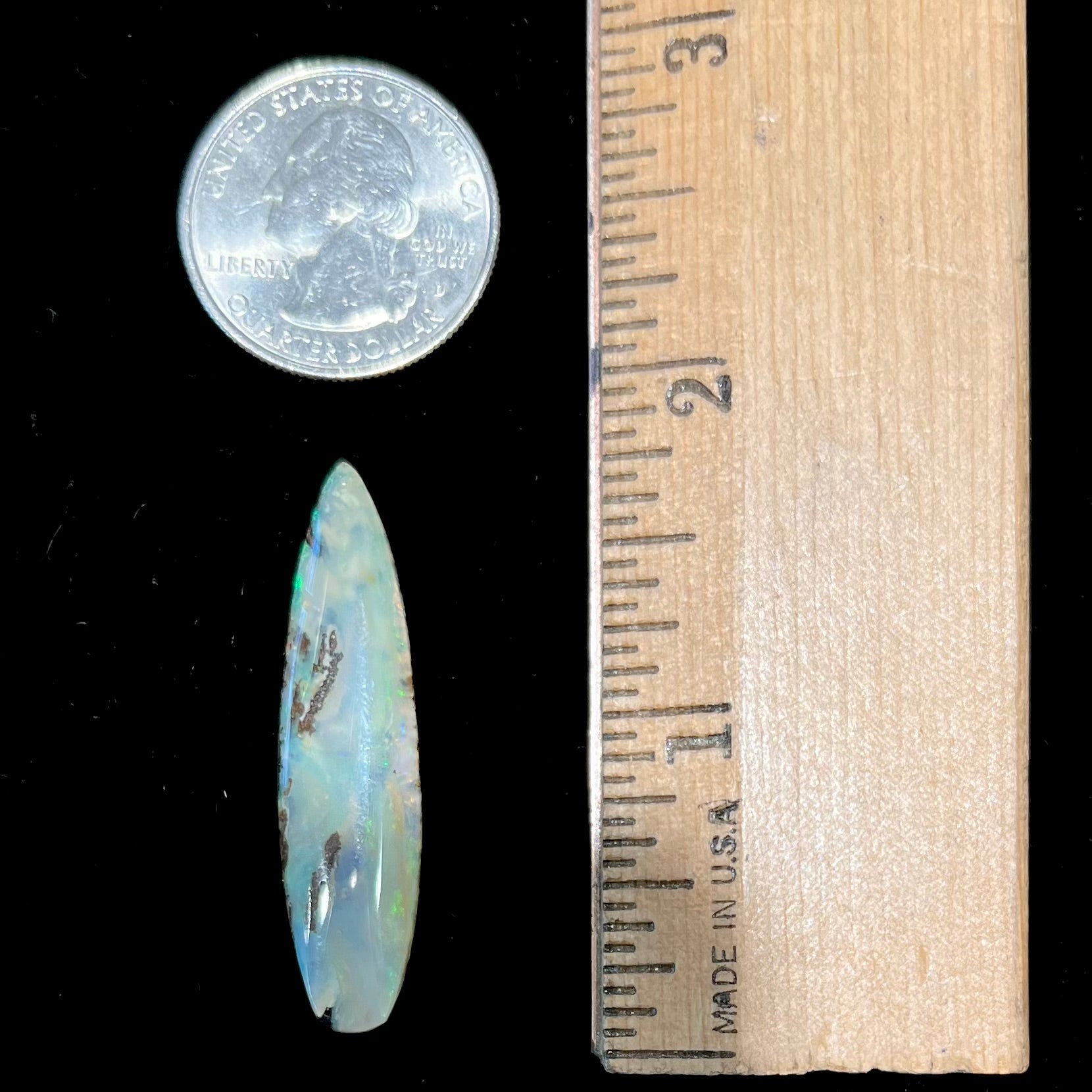 A loose, polished, point shape Quilpie boulder opal stone from Queensland, Australia.