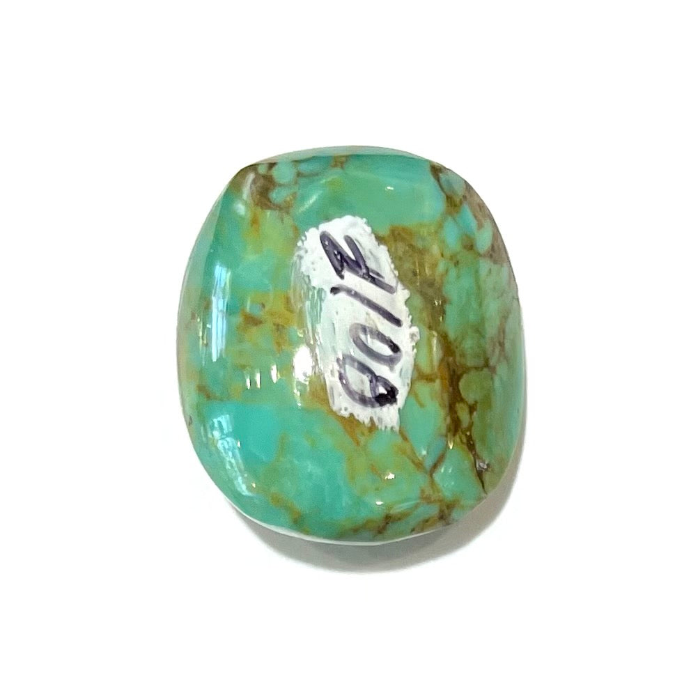 A loose, polished turquoise cabochon from Manassa, Colorado.