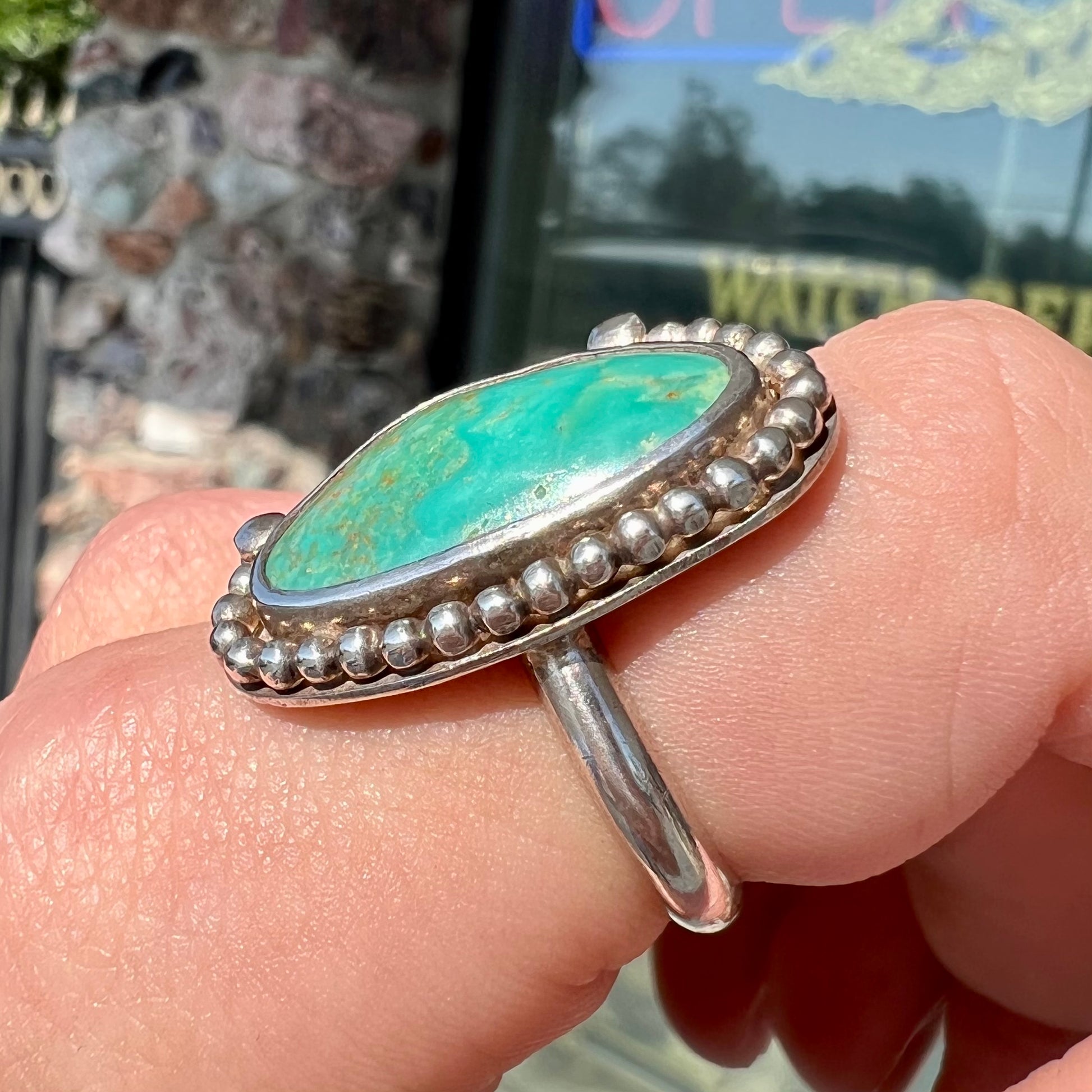 A sterling silver, Native American style green turquoise ring.  The turquoise is from the Royston Mining District.