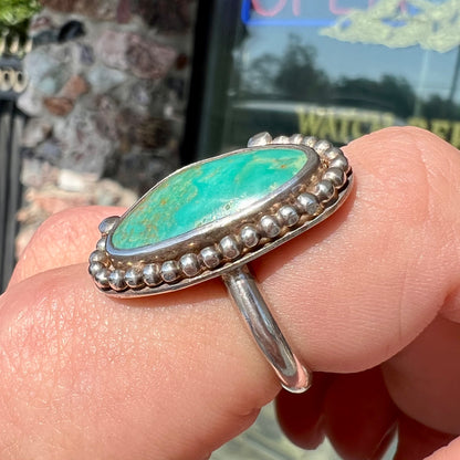 A sterling silver, Native American style green turquoise ring.  The turquoise is from the Royston Mining District.