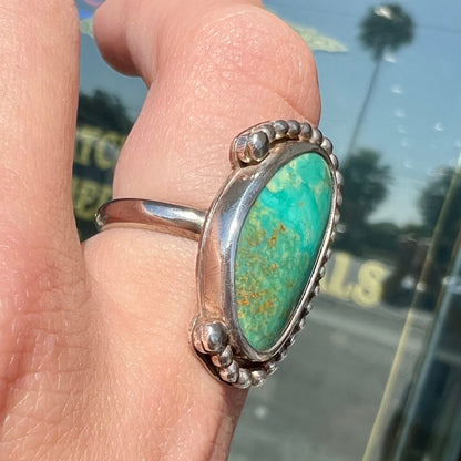 A sterling silver, Native American style green turquoise ring.  The turquoise is from the Royston Mining District.