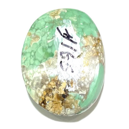 An oval cabochon cut green Variscite stone from Utah, USA.