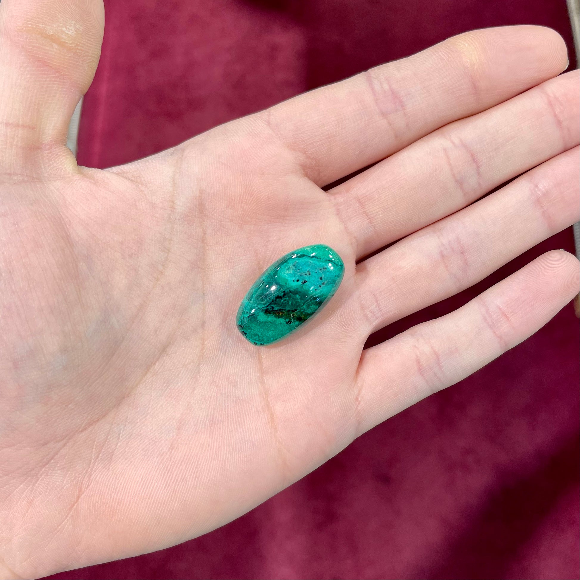A loose, green turquoise cabochon from Royston District, Nevada.