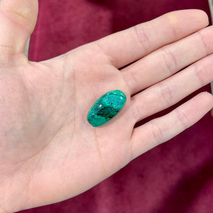 A loose, green turquoise cabochon from Royston District, Nevada.