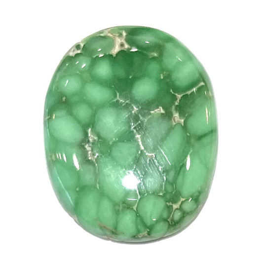 A loose, oval cabochon cut variscite stone from Utah, USA.