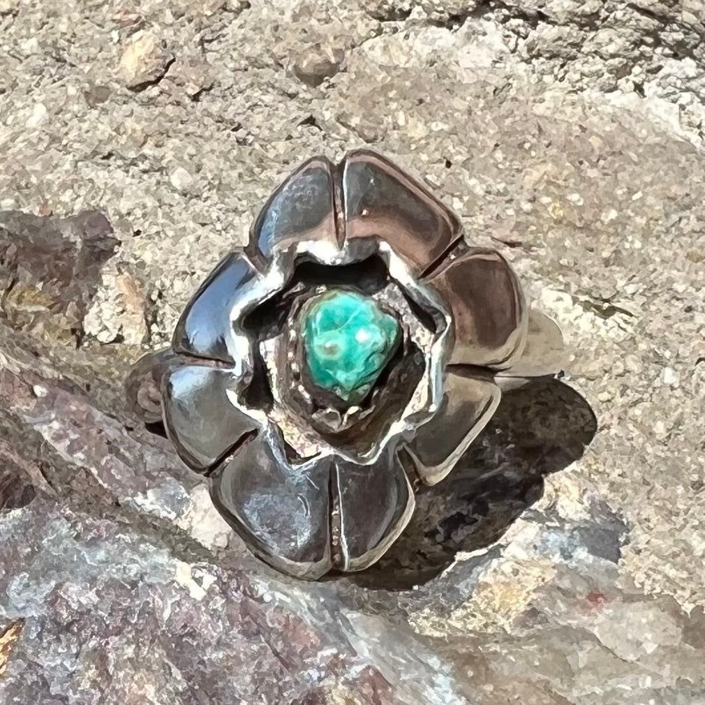 A handmade, sterling silver Native American turquoise nugget ring.