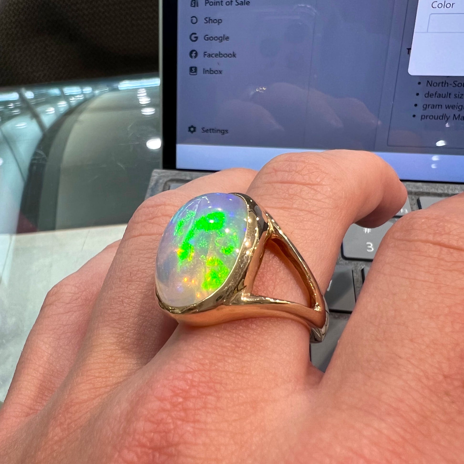 A gold split shank solitaire ring set with an oval cabochon cut 16.83 carat Ethiopian jelly fire opal.