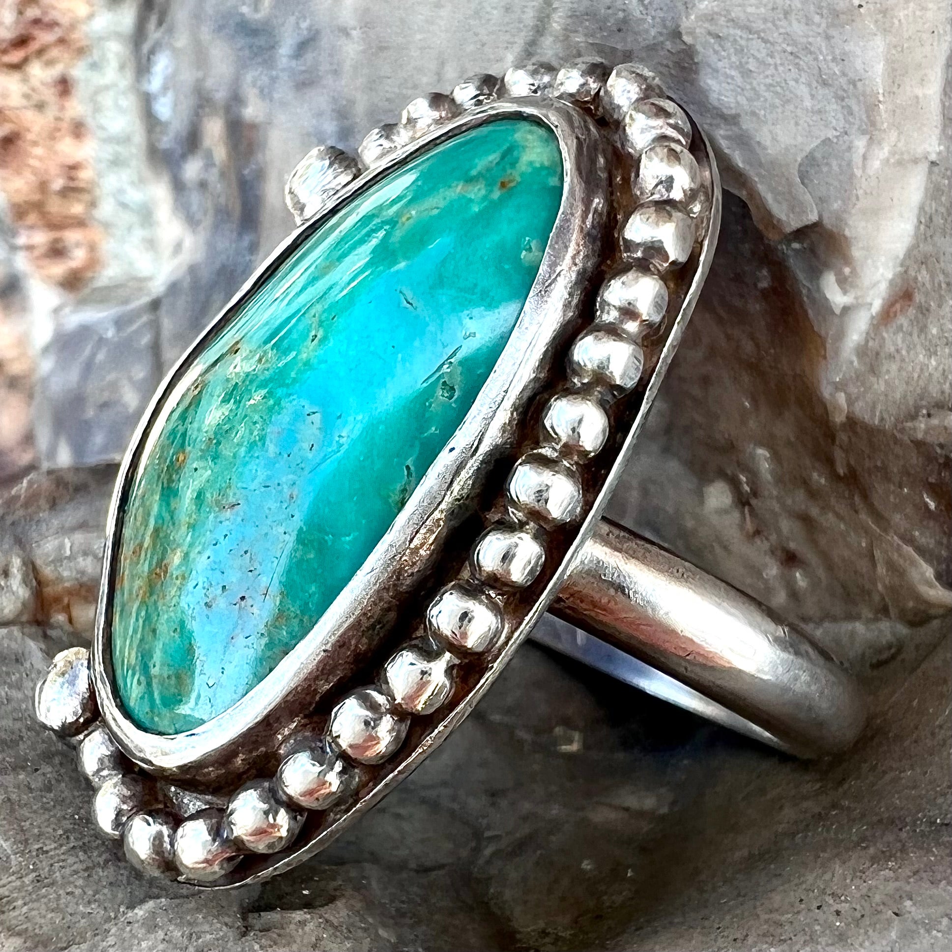 A sterling silver, Native American style green turquoise ring.  The turquoise is from the Royston Mining District.