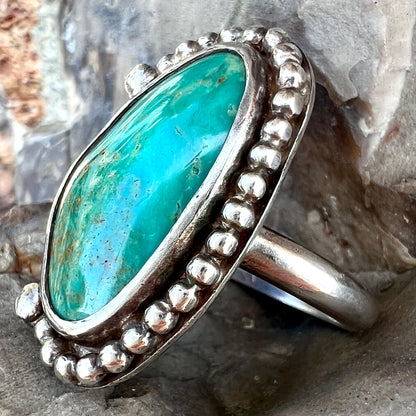 A sterling silver, Native American style green turquoise ring.  The turquoise is from the Royston Mining District.
