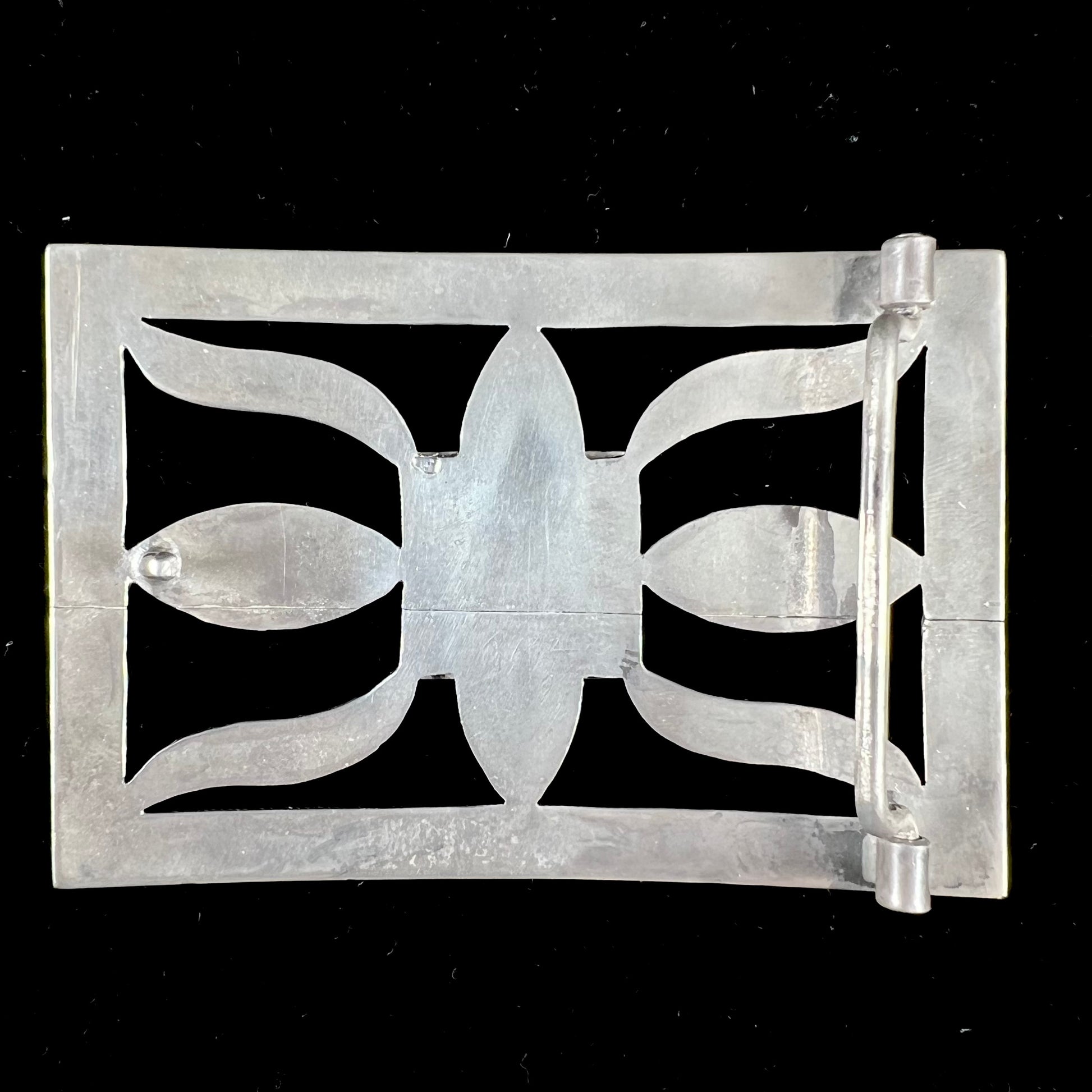 A handmade, Navajo style, sterling silver belt buckle set with a rectangular cabochon cut blue turquoise.